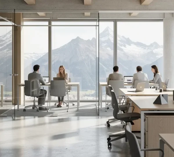 Vue d'un espace de travail moderne en Suisse avec des professionnels en réunion collaborative
